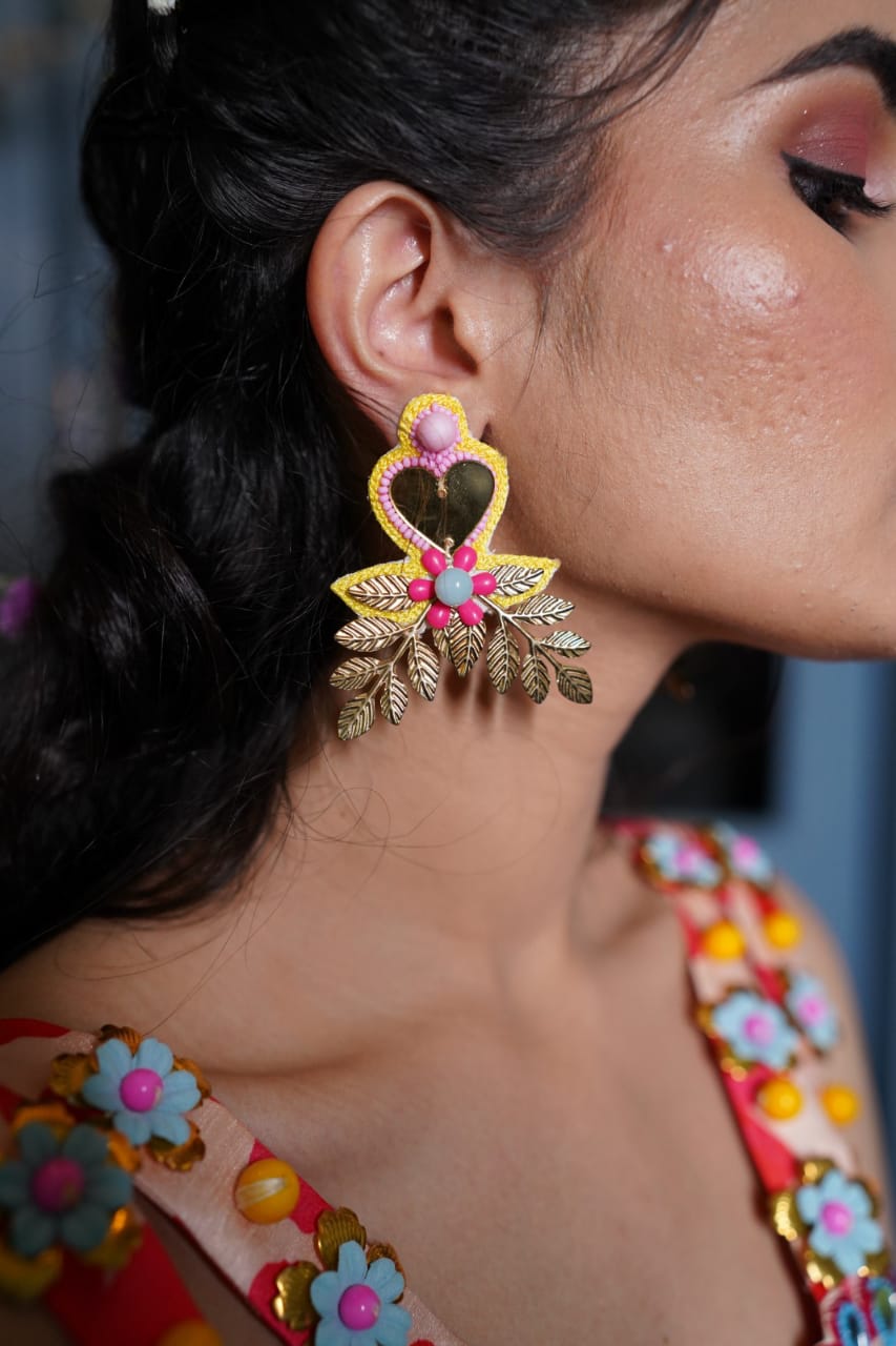 Yellow mirror beaded earrings .